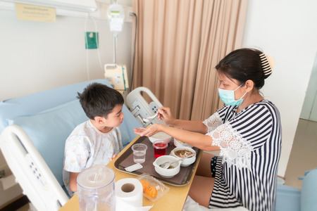 Mother take care of her son whiled he sicks in the hospital