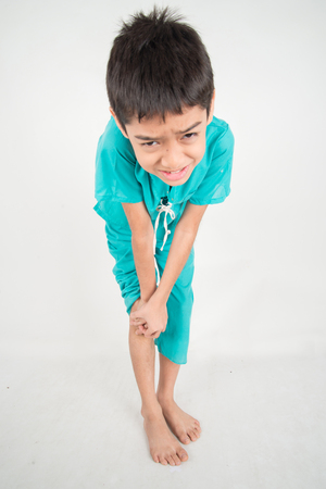 Little boy has leg pain from muscle aches on the kneeの写真素材