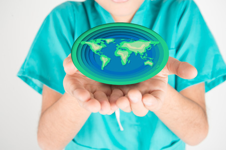 Love earth save our planet paper cut on boy's handの写真素材