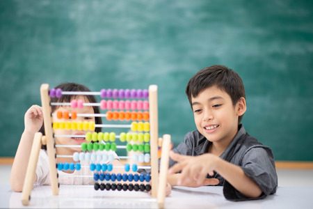 Students boy and girl leaning math in the class room Montessoriの写真素材
