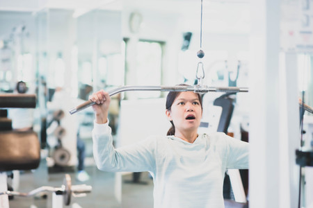 Asian woman work out exercise at Gym weight loss