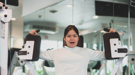 Asian woman work out exercise at Gym weight loss