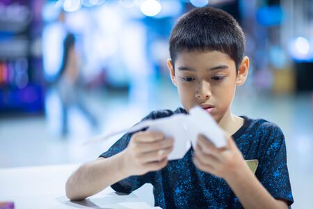 Kid learning Periodic table in the classroom at school