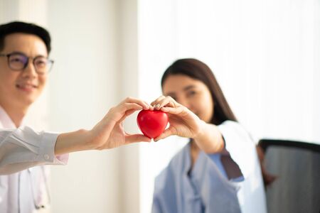 Asian Doctor and patient talking and checking  health care medicall sickness at hospitalの写真素材