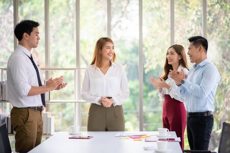 business team clapping hands after business seminarの写真素材