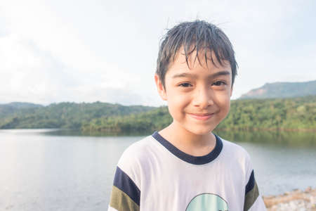 Little boy travelling at dam nature trip with familyの写真素材