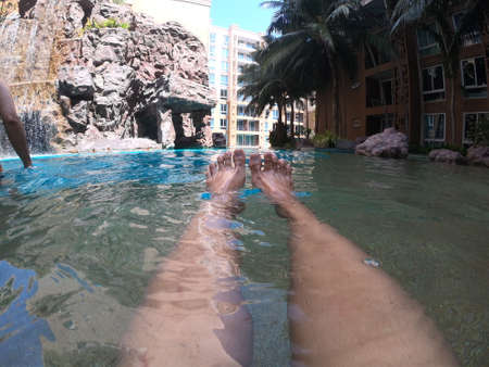 Happy family at water park on vacationの写真素材