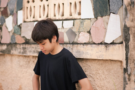 Teenage Boy's Expressions Collage: A captivating grid showcases a young Asian boy's diverse facial expressions, capturing a range of emotions from joy to contemplation.の写真素材