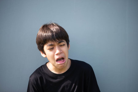 Teenage Boy's Expressions Collage: A captivating grid showcases a young Asian boy's diverse facial expressions, capturing a range of emotions from joy to contemplation.の写真素材