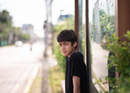 Teenage Boy's Expressions Collage: A captivating grid showcases a young Asian boy's diverse facial expressions, capturing a range of emotions from joy to contemplation.の写真素材