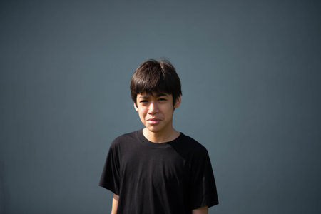 A young Asian boy's facial expression.の写真素材