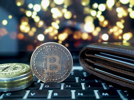 Bitcoin virtual money cryptocurrencies with bokeh in background, Virtual digital currency and financial investment trade concept.の写真素材
