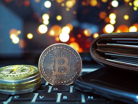 Bitcoin virtual money cryptocurrencies with bokeh in background, Virtual digital currency and financial investment trade concept.の写真素材