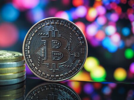 Bitcoin virtual money cryptocurrencies with bokeh in background, Virtual digital currency and financial investment trade concept.の写真素材