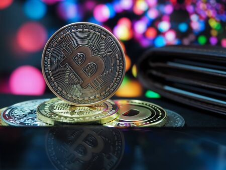 Bitcoin virtual money cryptocurrencies with bokeh in background, Virtual digital currency and financial investment trade concept.の写真素材