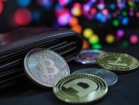 Bitcoin virtual money cryptocurrencies with bokeh in background, Virtual digital currency and financial investment trade concept.の写真素材