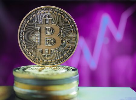 Bitcoin virtual money cryptocurrencies with graph in background, Virtual digital currency and financial investment trade concept.の写真素材