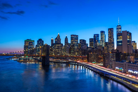 Brooklyn Bridge in Manhattan downtown with Cityscape at sunset New York USAの写真素材