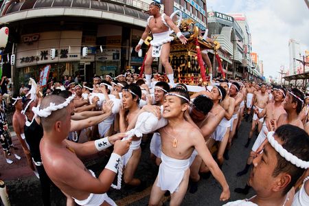 Kagoshima City, Japan, July 19, 2009. Participants of the Ogion festival carry a heavy portable shrine which has one of their leaders on it. のeditorial素材