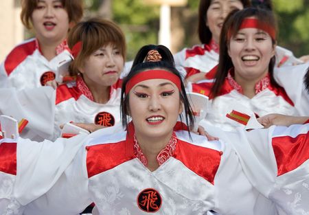 Kagoshima City, Japan, May 3, 2007. Dancers in white and red costume performing  in the Daihanya Festival held in Kagoshima City, Japan.のeditorial素材