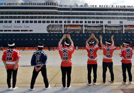 Kagoshima City, Japan, October 8, 2007  Taiko Drummers wave farewell to the first cruise ship to dock at the newly built marine port, the  ms Amsterdam のeditorial素材