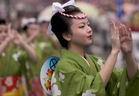 Kagoshima City, Japan, November 3, 2005. Women in yukata kimono dancing in symmetry during the Ohara Matsuri dance festival.のeditorial素材