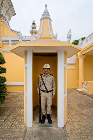 Phnom Penh, Cambodia, January 2, 2008,  A palace guard at his post outside the palace in Phnom Penh.のeditorial素材