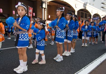 Kagoshima City, Japan, November 3rd, 2006.  Children in happi coats dancing in  symmetrical lines during the Ohara Matsuri dance festival. The festival has over 10,000 dancers participating in any given year.のeditorial素材