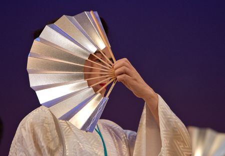 Kagoshima City, Japan, October 27, 2007. An older Japanese dancer in kimono perform with a fan onstage in the Taniyama Furusato Matsuri festival held in Kagoshima City, Japan.のeditorial素材