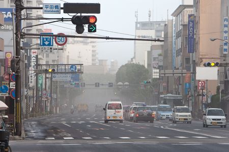 Kagoshima City, Japan, June 3, 2010. Traffic is affected as ash blankets the city after an eruption of the volcano Sakurajima.のeditorial素材