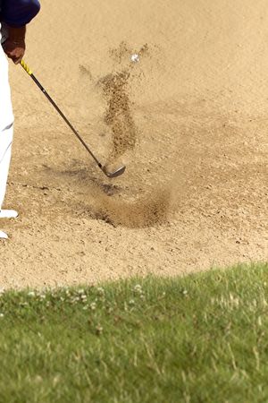 An action shot from the fairway bunkerの写真素材