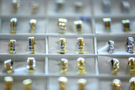 Some pair of gold rings in a shop window