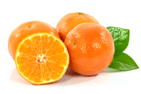 Fresh tangerines with leaves isolated on white backgroundの写真素材