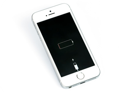 Krynica, Poland - March 14, 2017: Presentation of low battery level on new model iPhone SE Silver 16GB from Apple Inc.のeditorial素材