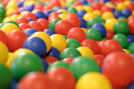 Multicolored background with plastic balls in children's play pool.の写真素材