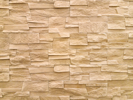 Modern sandstone stone wall background texture.