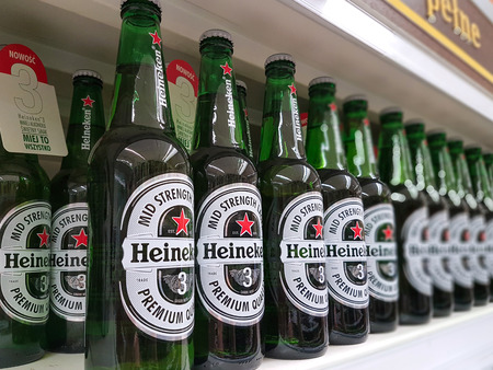 Nowy Sacz, Poland - June 25, 2017: Heineken Beer on store shelves for sale in a Tesco Hypermarket. Heineken is famous Dutch brewing company.のeditorial素材