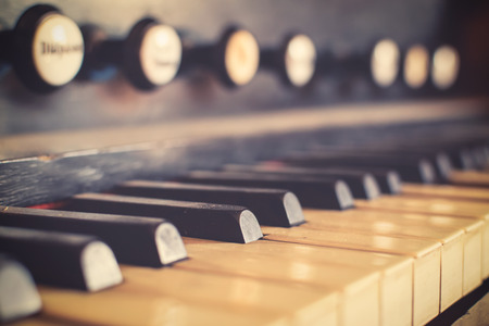old styled and retro vintage harpsichord as background - very low DOF.の写真素材
