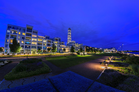 Malmo, Sweden - July 25, 2017: Night panorama of Luxury apartments in the Western Harbour in Malmo (Vastra Hamnen) on the background of the Turning Torso skyscraperのeditorial素材