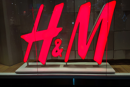 Nowy Sacz, Poland - December 20, 2017:  Sign of the  H&M store on the shopping window in close-up....