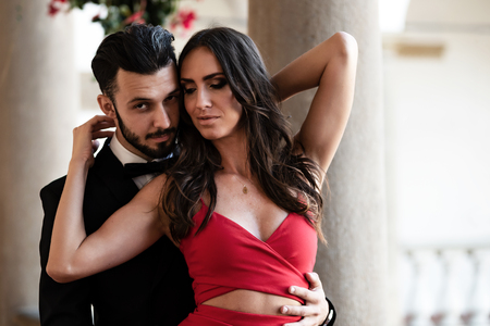 Portrait of an elegant fashion couple in love on a romantic date during a luxury banquet.の写真素材