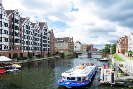 Gdansk, Poland - June 26, 2018: Tourist cruise ship on Motlawa river in historical Old Town of...