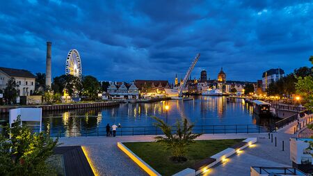 Gdansk, Poland - August 13, 2019: Beautiful landscape of the old town in Gdansk over Motlawa River at dusk in Polandのeditorial素材