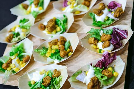 Set of healthy and tasty starters in organic wooden bowls in close-up