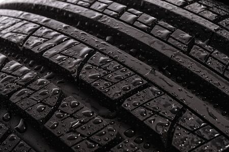 Details of new and modern multi season car with water drops. Studio shotの写真素材