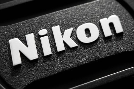 Krakow, Poland - November 25, 2019: Nikon sign on lens cap, Nikon, is a Japanese multinational corporation specializing in optics and imaging products.のeditorial素材