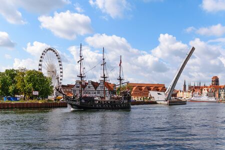Gdansk, Poland - August 08, 2019: View of Gdansk Old Town and tourist ship on the Motlawa River.