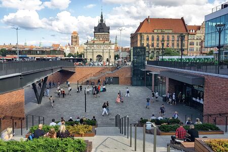 Gdansk, Poland - August 14, 2019: People are resting on the square in front of the entrance to the...