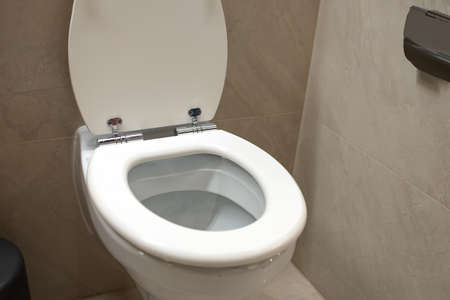 White new ceramic toilet bowl in the bathroom in close-upの写真素材