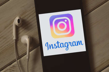 Krakow, Poland - October 09, 2020: Instagram application sign on the smartphone screen. Instagram is a famous free image and video social sharing service.のeditorial素材